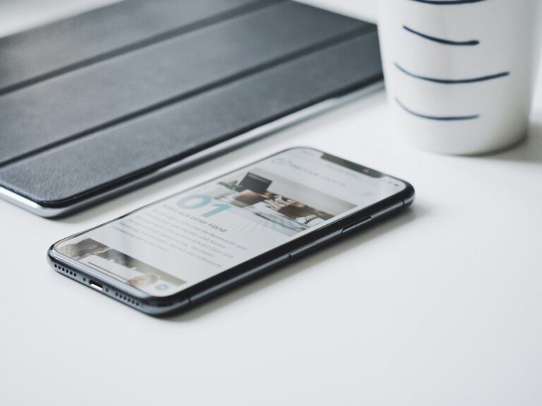Smartphone on a desk representing cold calling and texting compliance for real estate wholesalers