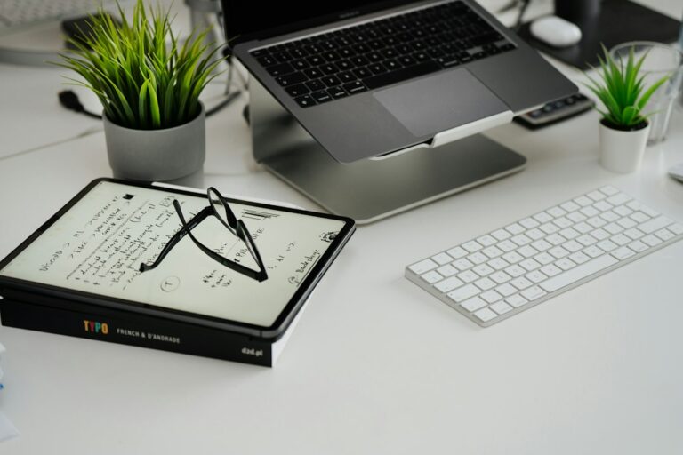 Home office desk with a laptop used for virtual real estate wholesaling
