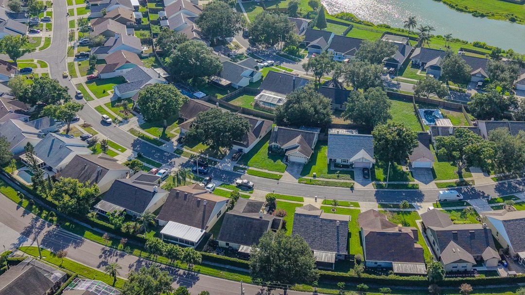 Aerial view of a residential neighborhood with winding streets, the kind of local market where you measure absorption rate in real estate