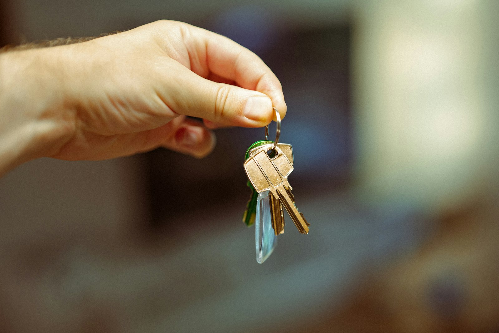Buyer holding new house keys after the financing contingency cleared