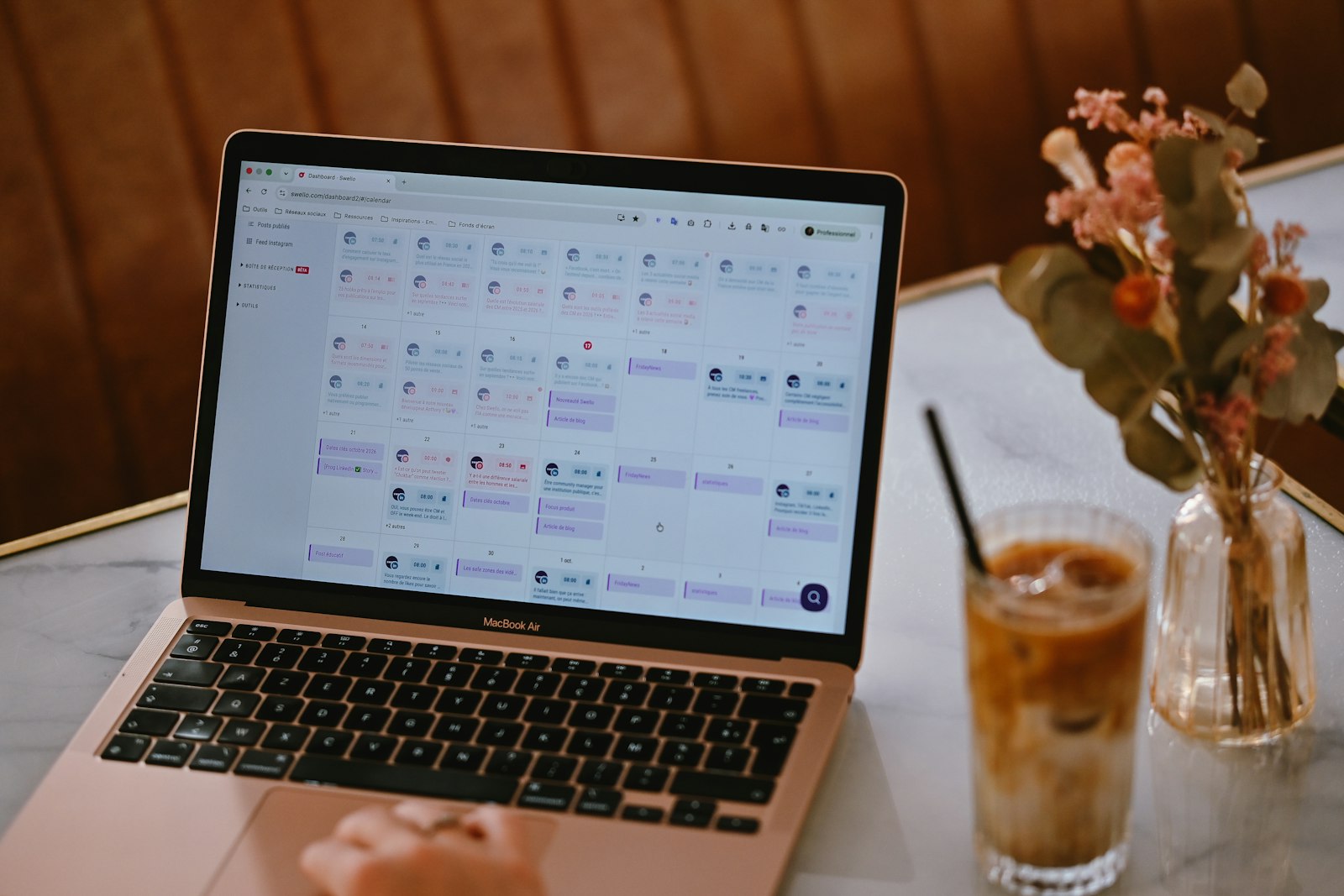 Laptop showing a social media content calendar used to plan facebook ads for real estate investors