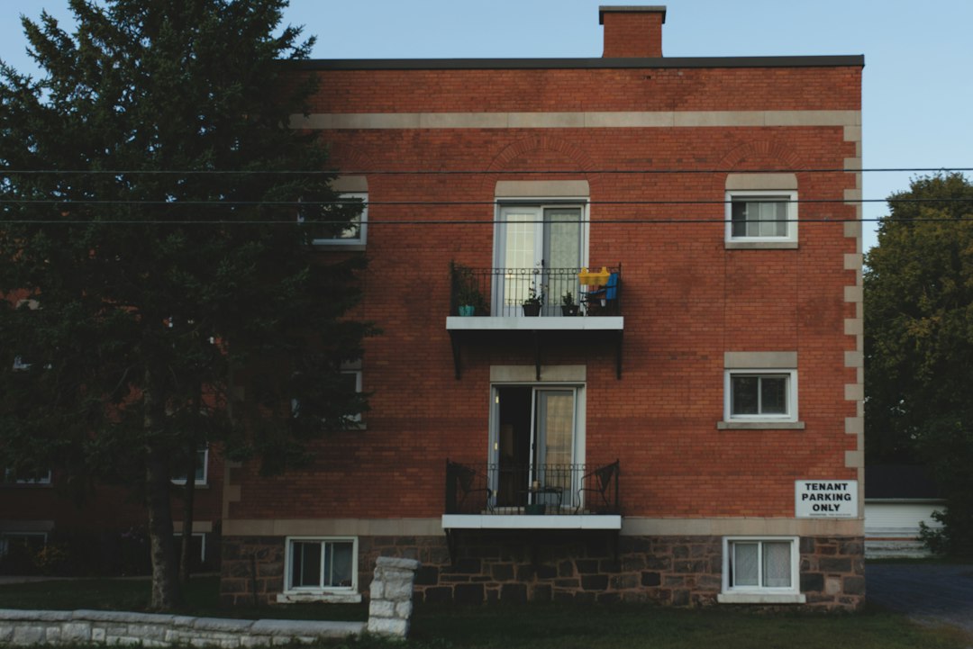 Small brick apartment building whose rents and expenses determine its net operating income