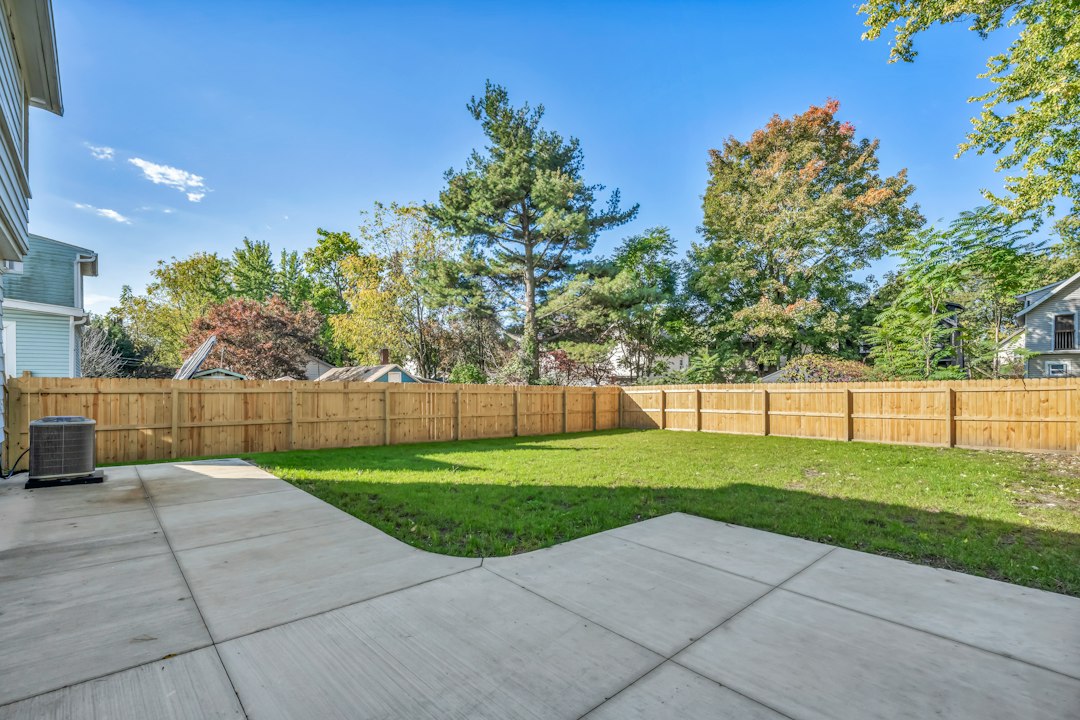 Renovated two-story rental house with a fenced yard, the type of property an investor might buy using the Morby method