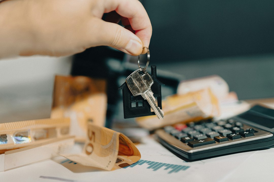 Seller net sheet worksheet with a calculator and house keys on a desk