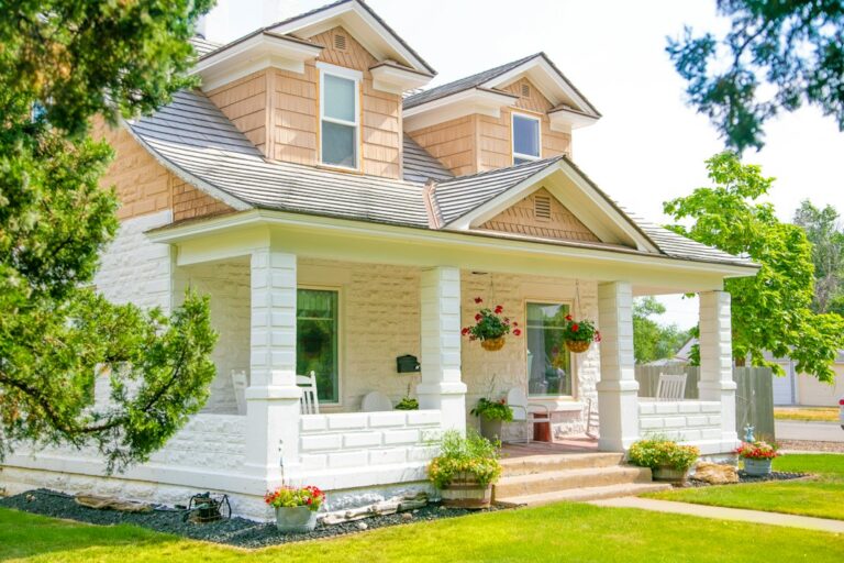 Front of a single-family house on a sunny day, the kind of property marketed through real estate dispositions