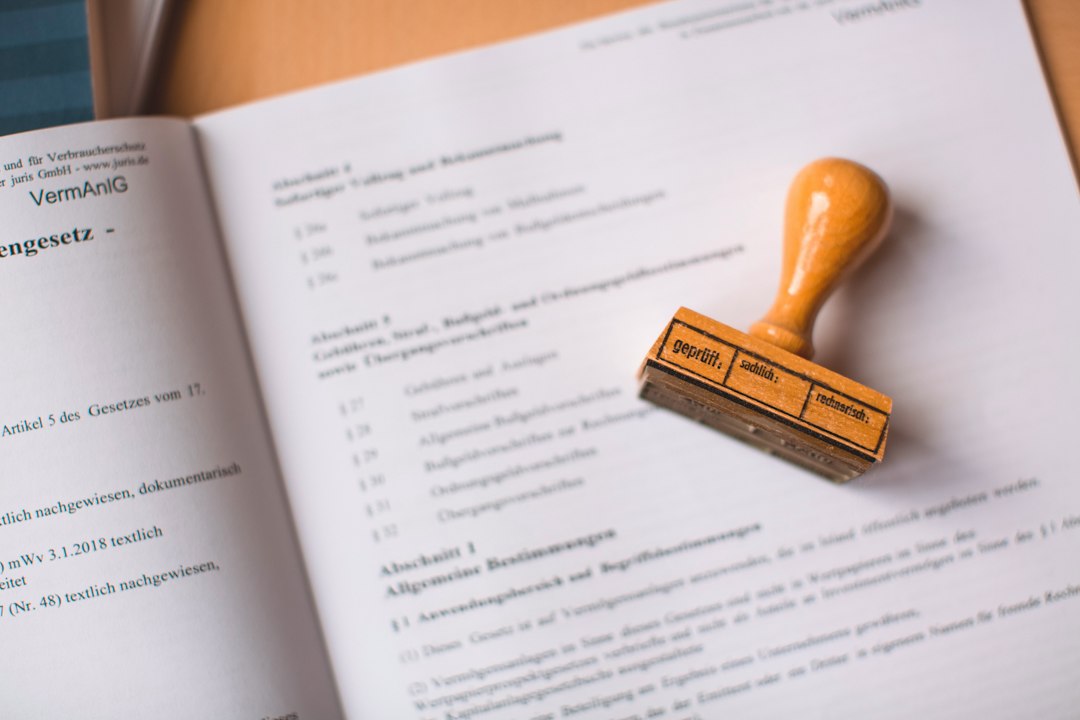 Stamped property tax documents on a desk, illustrating a tax lien vs tax deed sale