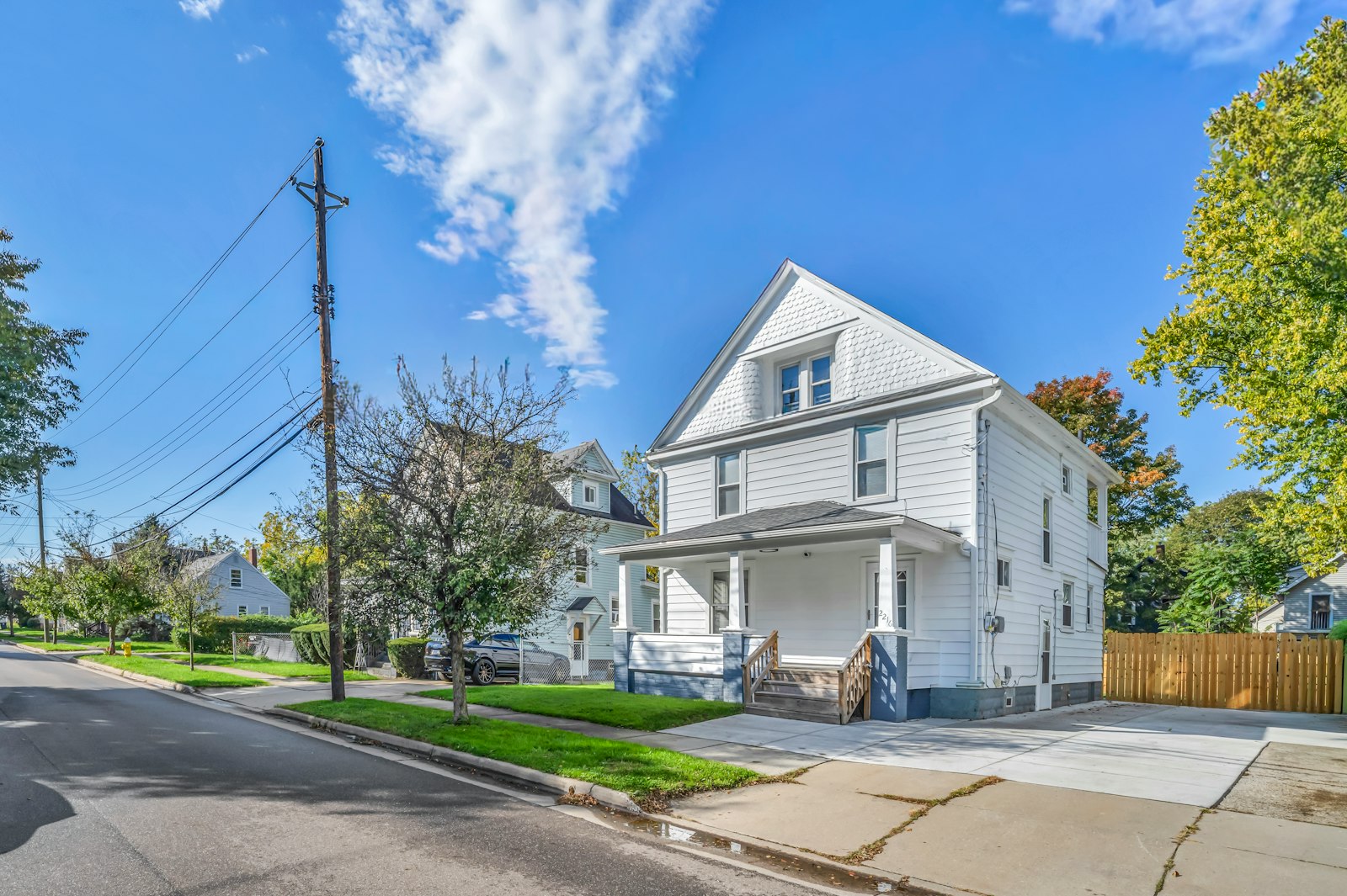 Renovated two-story house on a tree-lined street, the kind of property where a certificate of occupancy sets the legal unit count