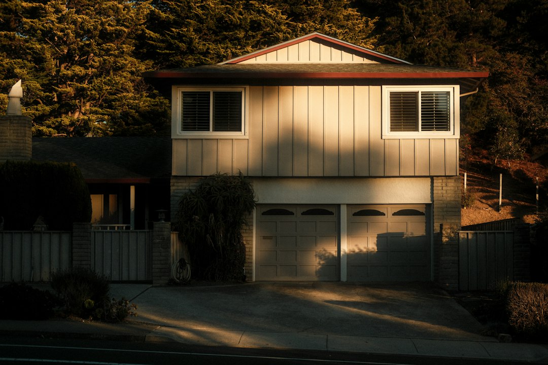 Two-story suburban home with a garage, a common type of property for house hacking by renting out part of it