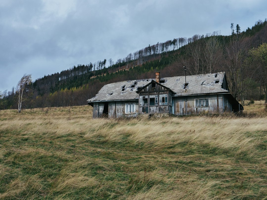 Vacant, weathered house of the kind a city might declare a condemned house