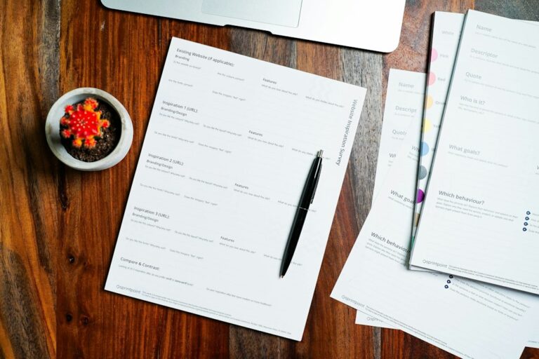 Signed real estate papers and a pen on a wooden table, representing a creative financing agreement
