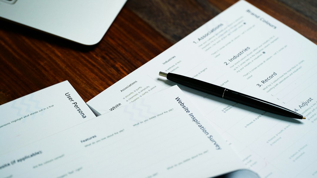 Pen on loan documents for a seller financing deal